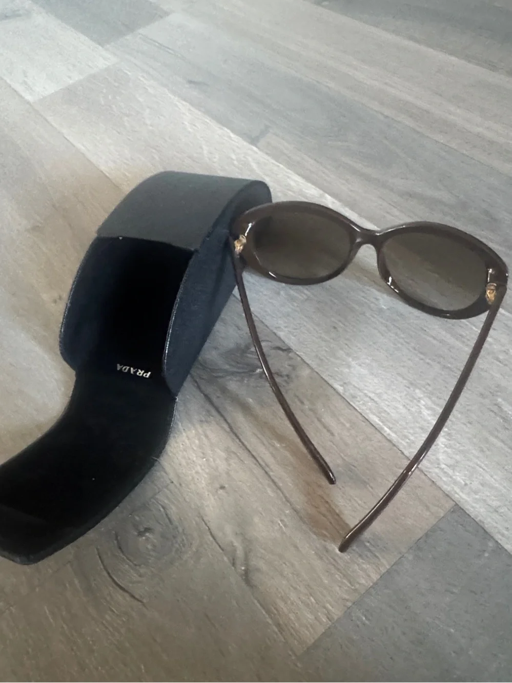 Prada Brown Women's Oval Sunglasses with Dark Brown Lenses